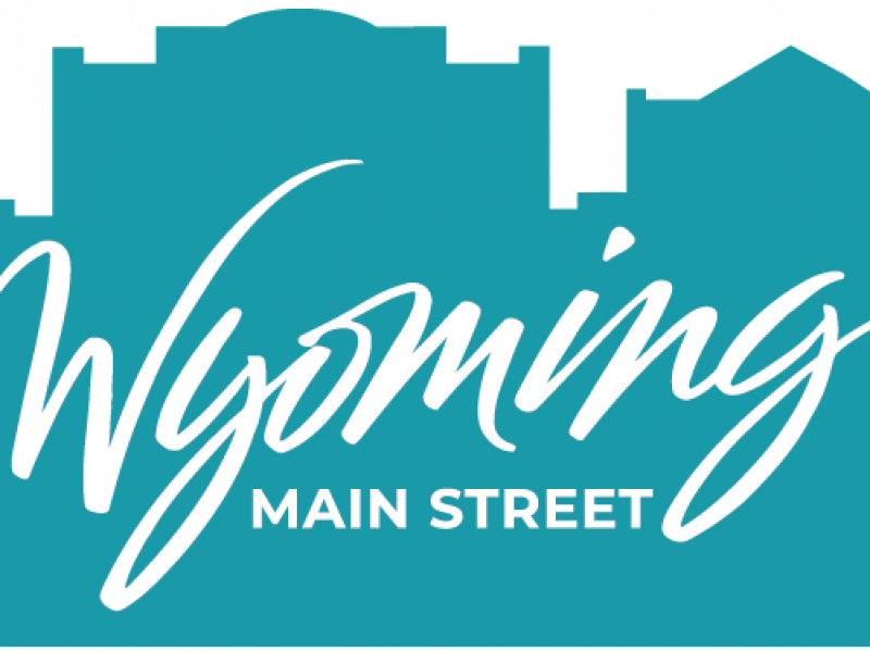 Wyoming Main Street Primary Logo in Teal with building outlines behind text