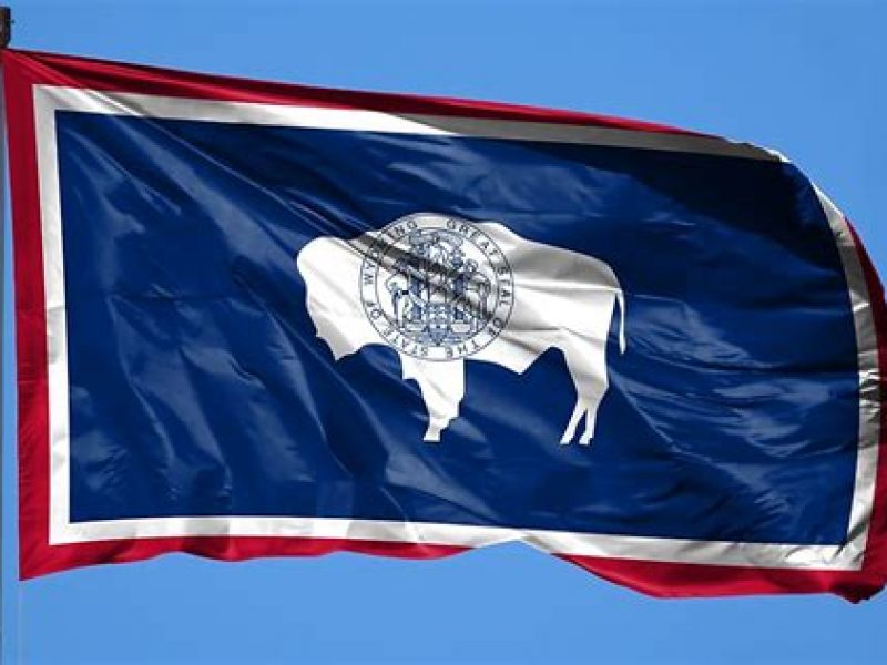 Wyoming flag with blue sky background